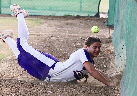 Lemoore's Kobie Perryman dives for a foul ball, just missing the catch in the second inning. The Tigers lost 8-5 to Hanford's Sierra Pacific.